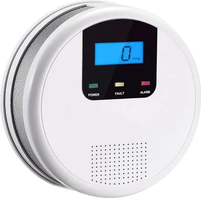 A white carbon monoxide detector with a digital display.