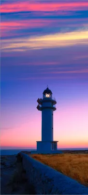 Produktbild von Türtapete Türposter Leuchtturm am Abend auf den Balearen Malerischer Himmel - Größe: 93 x 205 cm