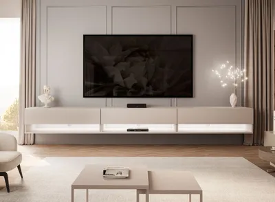 A modern living room with a wall-mounted TV and entertainment unit.