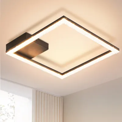 A modern square LED ceiling light fixture with a black metal frame and crystal accents, mounted on a white ceiling.