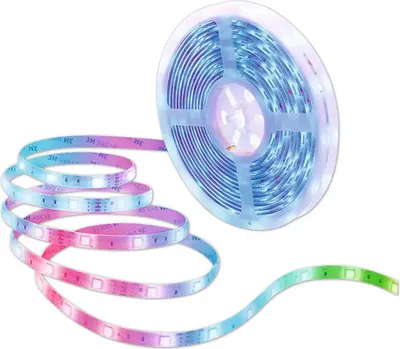 A roll of LED light strips with a portion unrolled and illuminated with a gradient of colors.