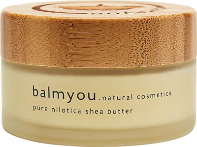 A close-up studio shot of a jar of Balmyou pure nilotica shea butter with a wooden lid.