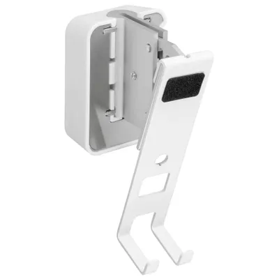 A white wall mount bracket for a speaker.