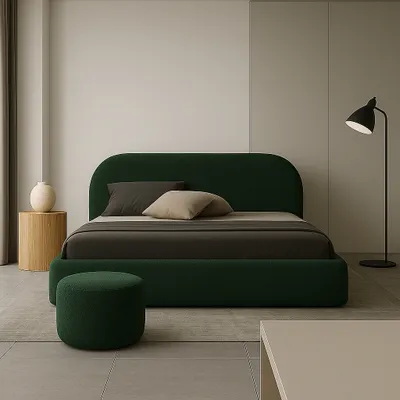 A minimalist bedroom scene featuring a dark green upholstered bed.