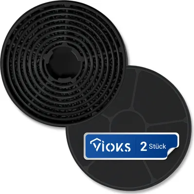 Two black circular carbon filters for a range hood, with a blue label on one of them.