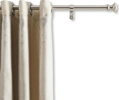 A close-up of a curtain rod with a beige curtain hanging from it.