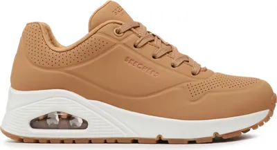 A side view of a tan Skechers Uno-Stand on Air sneaker with a white sole and visible air cushioning.