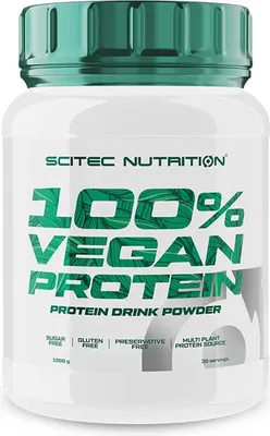 A white plastic container of protein powder with green text and lid.