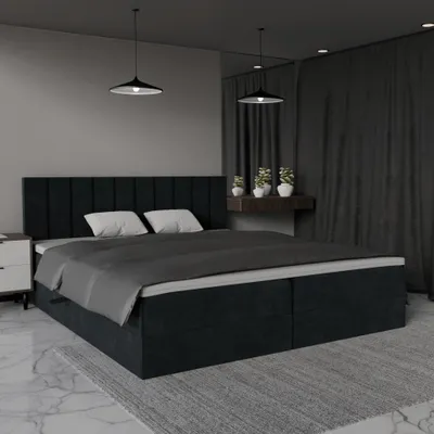 A dark gray upholstered bed with two pillows and a dark gray duvet is shown in a bedroom setting.