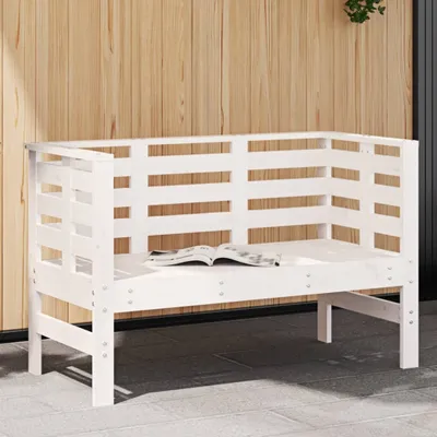 A white wooden bench is shown in front of a wood-paneled wall.