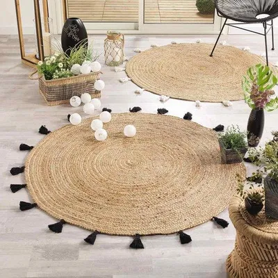 Productafbeelding van Rond vloerkleed, diameter ongeveer 120 cm - Jute, effen kleur, met zwarte pampasgrasdecoratie