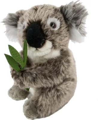 A stuffed koala bear holding a green leaf.
