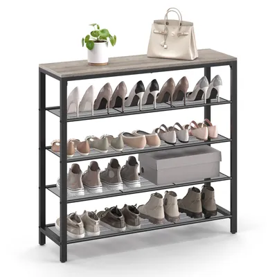 A multi-tiered shoe rack with various shoes and a handbag on top.