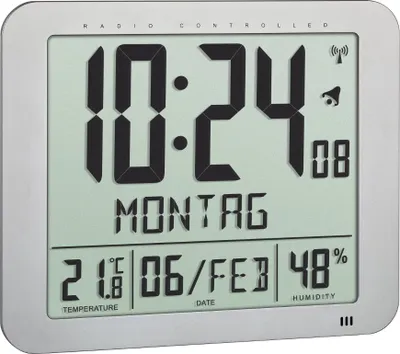 A digital clock displaying the time, date, temperature, and humidity.