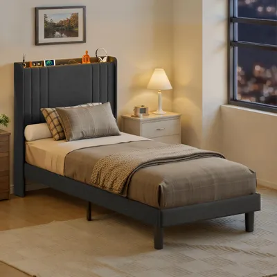 A bedroom scene with a single bed, nightstand, and window.