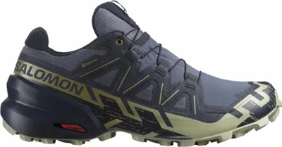 A side view of a blue Salomon Speedcross GTX sports shoe against a white background.
