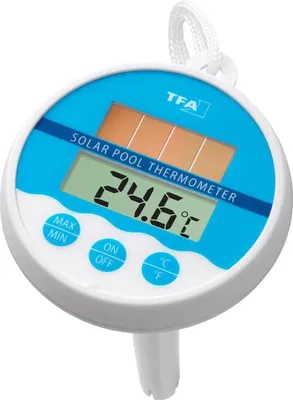 A floating solar-powered pool thermometer showing a temperature reading.