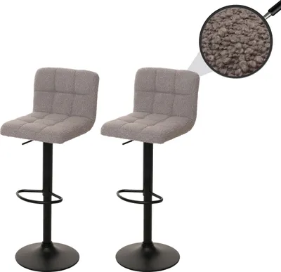 Two gray bar stools with black bases are shown against a white background. A close-up inset shows the texture of the fabric.