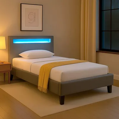 A modern bed with LED lighting in a room.