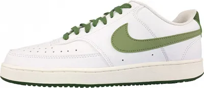A side view of a white Nike Court Vision Low sneaker with green accents.