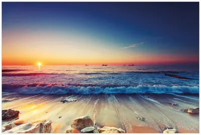 Produktbild von Wallario Wandbild aus Acryl, 90 x 60 cm, freischwebende Optik - Sonnenuntergang am Meer mit Wellen am Strand