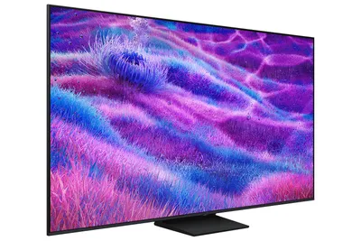 A television set with a colorful abstract image displayed on its screen, placed on a black stand against a white background.