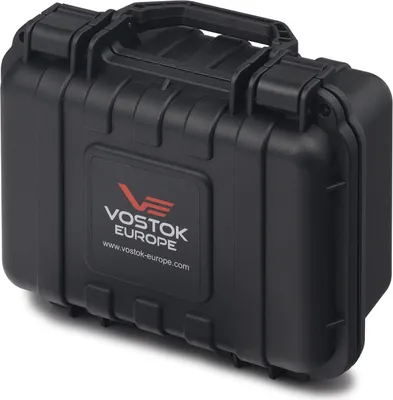 A black Vostok Europe branded case is shown in a studio setting.