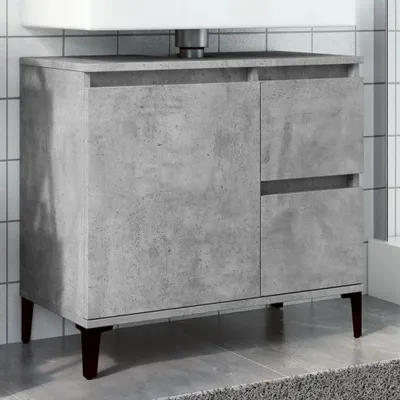 A concrete-effect bathroom vanity cabinet with two doors and two drawers, supported by dark brown legs, is shown in a bathroom setting.