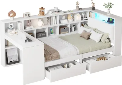 A white storage bed with a built-in desk and shelving unit, illuminated by LED lights.