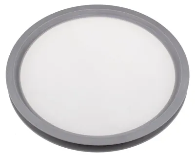 A close-up, top-down view of a round, gray-edged filter with a white mesh center.