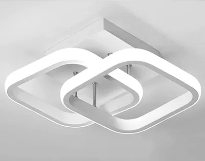 A modern, white LED ceiling light fixture with two interlocking square frames, mounted on a white ceiling.