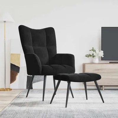 A black velvet armchair and ottoman are shown in a living room setting.