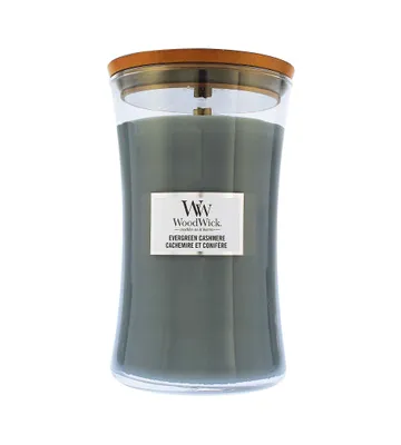 A WoodWick Evergreen Cashmere candle in a glass jar with a wooden lid, presented on a white background.