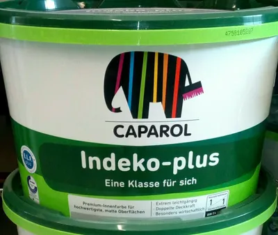 A close-up of a bucket of Caparol Indeko-plus paint.