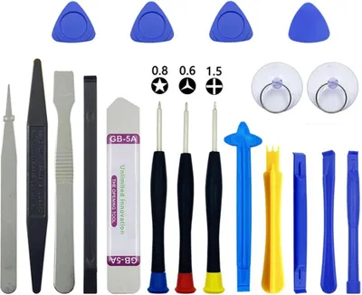 A collection of electronic repair tools laid out on a white background.