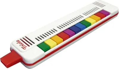 A white melodica with colored keys on a white background.