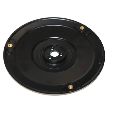 A black circular disc with gold fasteners, likely a part for a lawnmower robot.
