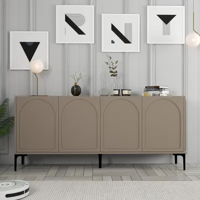A modern living room with a sideboard and artwork on the wall.