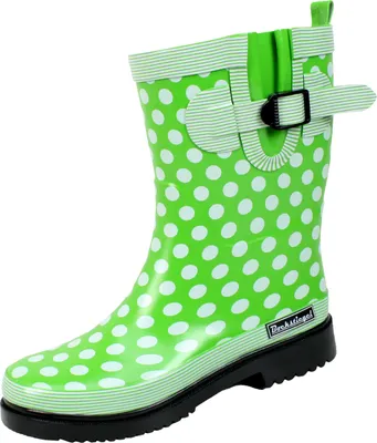 A single green and white polka dot rain boot is shown against a white background.