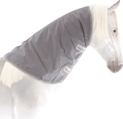 A gray horse neck cover is shown on a white horse.