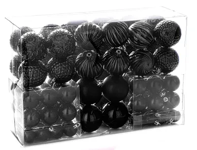 A clear, professional studio shot of a box of black Christmas ornaments.