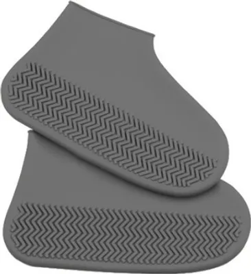 A pair of gray shoe covers with a textured sole.