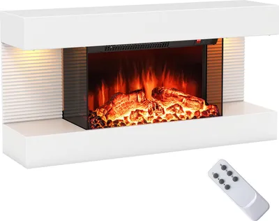 A white electric fireplace with a glass front showing a realistic flame effect and logs. A remote control is placed in the bottom right corner.