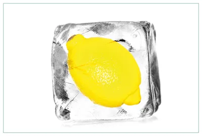 Produktbild von Wallario Küchenrückwand aus Glas, Größe: 90 x 60 cm, Motiv: Zitrone in Eiswürfel - Eiskaltes Obst | Spritzschutz | abwischbar | pflegeleicht | in