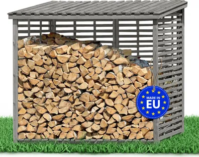 A wooden log store filled with firewood, placed on a grassy area with a white background.