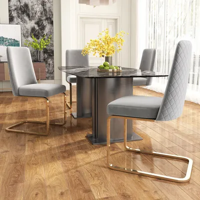 A dining set with four chairs and a table in a well-lit room.