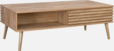 A wooden coffee table with a sliding door and an open shelf, shown against a white background.