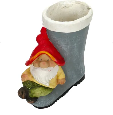 A decorative garden gnome sitting in a boot planter.