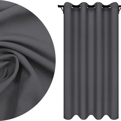 A close-up of fabric texture and a hanging curtain.