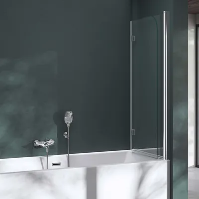 A shower screen attached to a bathtub with a shower head and faucet visible.